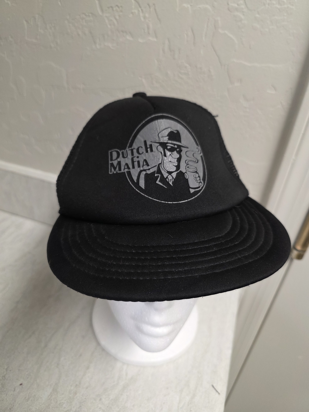 District Black Mesh Trucker Cap with Teal Tag